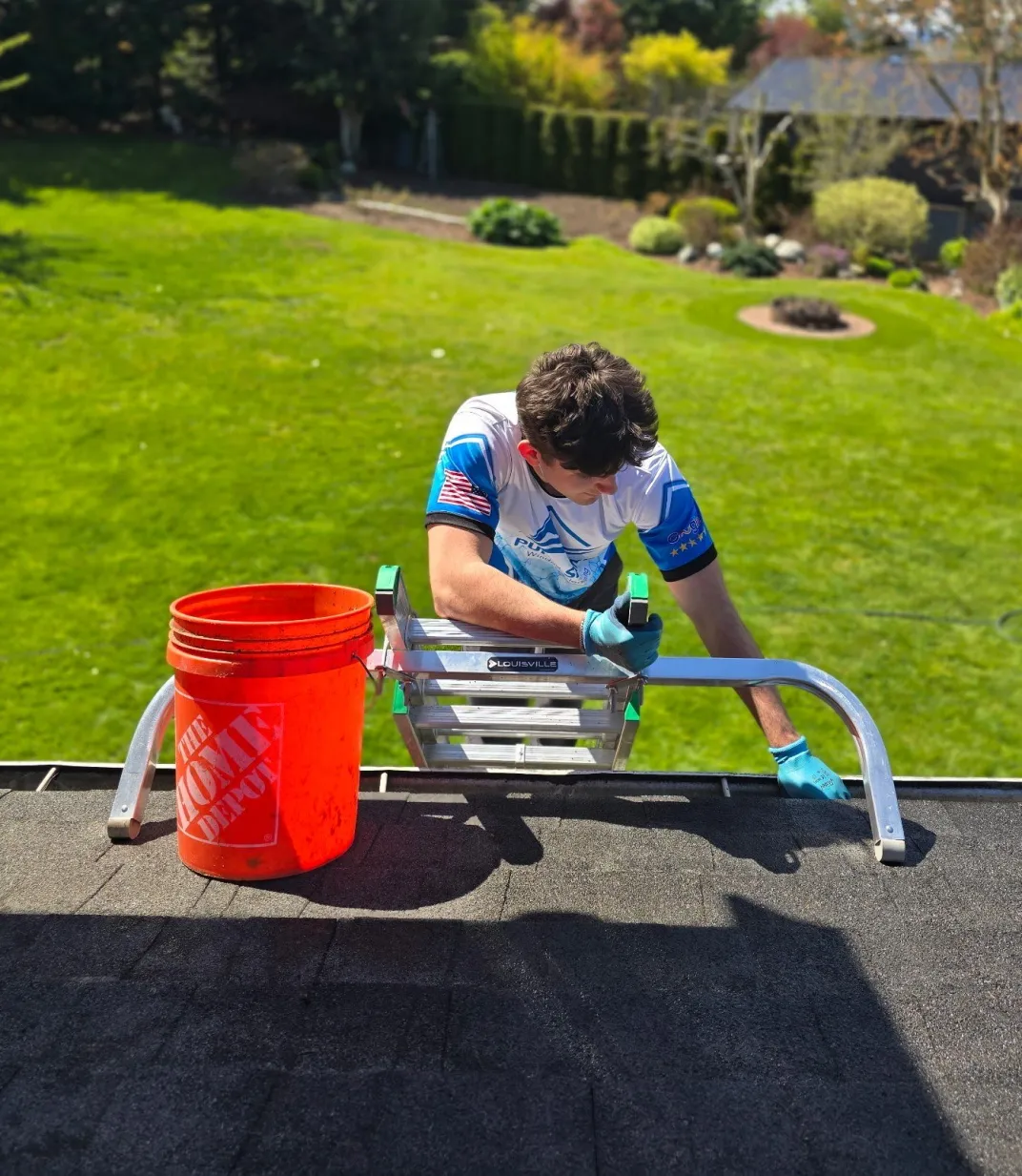 Technician on roof with equipment